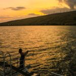 a sunset over a body of water